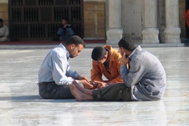Three men discussing