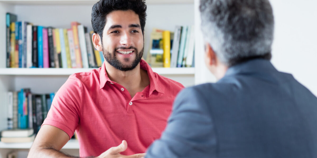 man chatting in a library